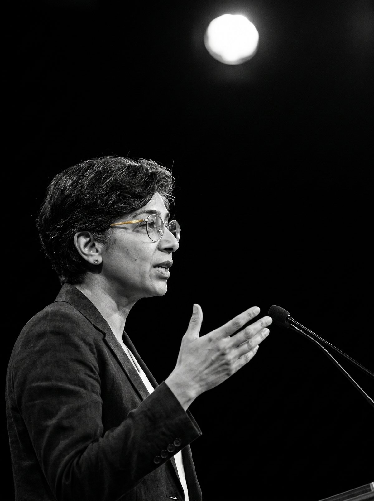 Maya speaking on stage